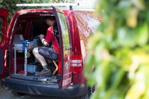 Locksmith cutting keys in mobile van